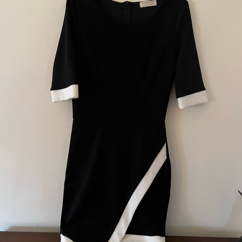 Black dress with white trim. - Picture 1 of 5